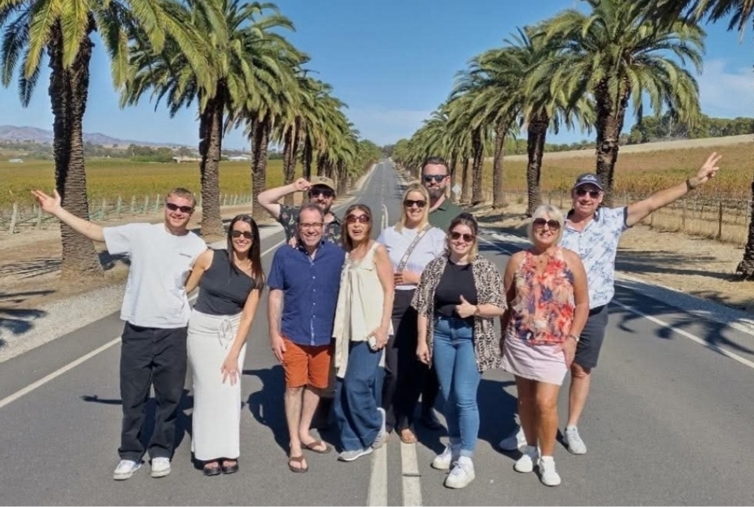 Tour group on the iconic palm tree-lined Seppeltsfield Road, Barossa Valley