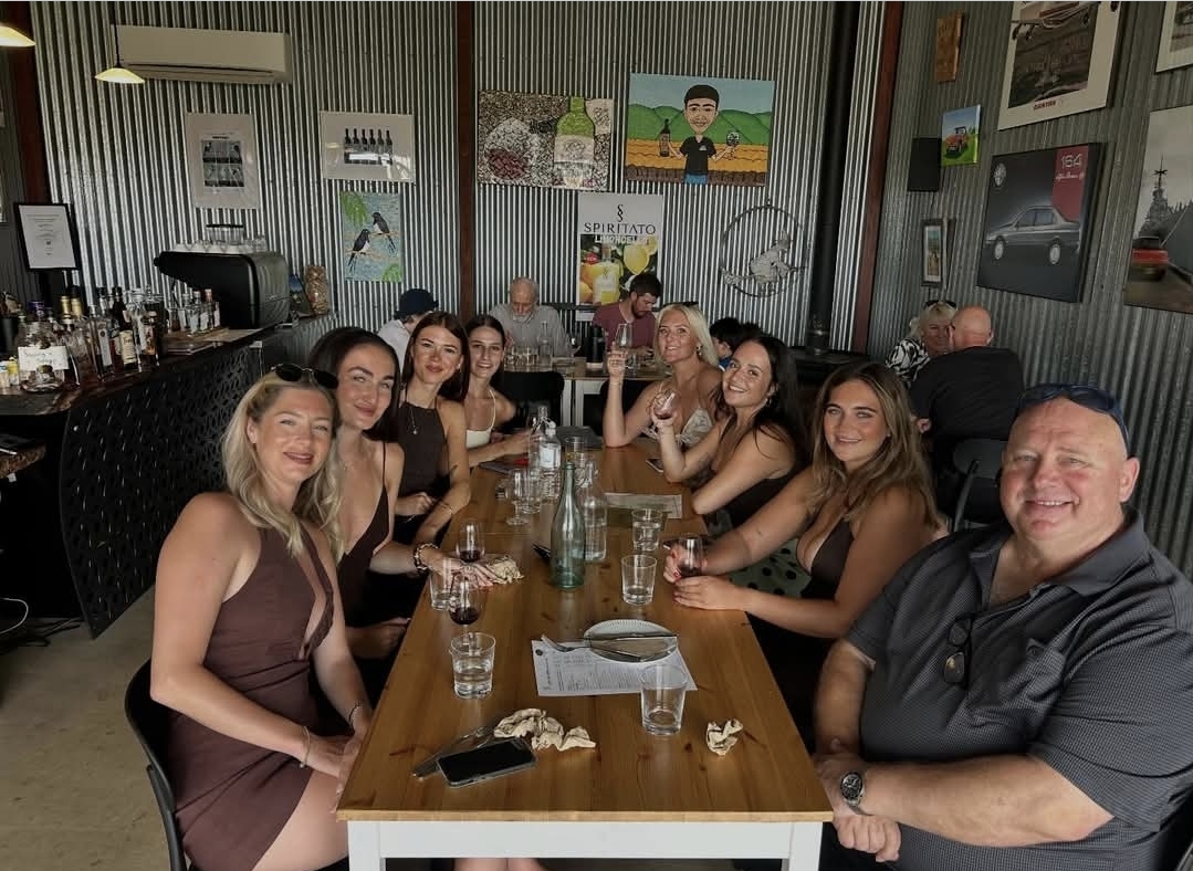 Group enjoying a meal and wine tasting together at Spiritato distillery, Barossa Valley